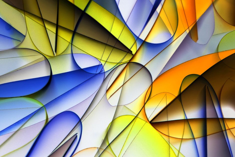Vivid abstract image featuring dynamic geometric shapes in blue, yellow, and orange hues.